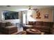 Cozy living room with comfortable seating, decor, and partial view of the modern kitchen at 2206 Hunters Greene Dr, Lakeland, FL 33810
