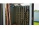 Refreshing outdoor shower with a wooden privacy screen and simple fixtures at 2206 Hunters Greene Dr, Lakeland, FL 33810