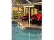 Relaxing outdoor patio with a pool, comfortable furniture, and a shaded seating area at 2206 Hunters Greene Dr, Lakeland, FL 33810
