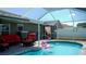 Inviting pool area with a screened-in enclosure and lounge area, perfect for relaxation at 2206 Hunters Greene Dr, Lakeland, FL 33810