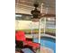 Inviting pool and patio area with a ceiling fan and comfortable outdoor seating at 2206 Hunters Greene Dr, Lakeland, FL 33810