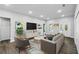 Staged living room featuring modern decor, recessed lighting, and lots of natural light at 225 Starling Ct, Kissimmee, FL 34759