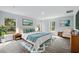 Spacious main bedroom featuring large windows, neutral colors, and wood-look flooring at 225 Starling Ct, Kissimmee, FL 34759