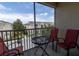 Relax on this screened balcony with seating and enjoy the view of the complex at 2301 Butterfly Palm Way # 303, Kissimmee, FL 34747
