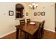 Dining area with modern chandelier situated next to the kitchen, perfect for entertaining at 2301 Butterfly Palm Way # 303, Kissimmee, FL 34747