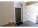Inviting front door to unit 303 with a 'Sweet Home' doormat at the entrance at 2301 Butterfly Palm Way # 303, Kissimmee, FL 34747