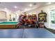 Recreation space with arcade games, ping pong, and pool table for community fun at 2301 Butterfly Palm Way # 303, Kissimmee, FL 34747
