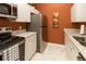 Cozy kitchen features stainless steel appliances, granite countertops, and white cabinets at 2301 Butterfly Palm Way # 303, Kissimmee, FL 34747