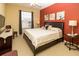 Bright bedroom with large bed, neutral linens, and decorative wall art at 2301 Butterfly Palm Way # 303, Kissimmee, FL 34747