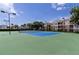 Well-maintained community tennis court with lights for evening play and beautiful surroundings at 2301 Butterfly Palm Way # 303, Kissimmee, FL 34747