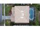 Top-down aerial perspective showcasing a home with a tile roof, a screened-in pool, and backyard for relaxation and enjoyment at 2408 Saint Augustine Blvd, Haines City, FL 33844