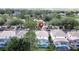 Aerial view of a residential neighborhood with well-maintained houses, green lawns and a community pool nearby at 2408 Saint Augustine Blvd, Haines City, FL 33844
