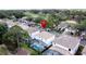 Aerial view of a home with a screened pool in a golf community showcasing its prime location and inviting outdoor space at 2408 Saint Augustine Blvd, Haines City, FL 33844