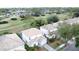 Real estate with tile roof and golf course view near single Gathering homes nestled in lush greenery in a desirable location at 2408 Saint Augustine Blvd, Haines City, FL 33844