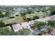 Real estate with tile roof and golf course view near single Gathering homes nestled in lush greenery in a desirable location at 2408 Saint Augustine Blvd, Haines City, FL 33844