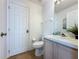 Clean and bright bathroom featuring neutral tones, a vanity with storage, and tiled floors at 2408 Saint Augustine Blvd, Haines City, FL 33844