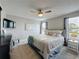 Comfortable bedroom with neutral decor, a ceiling fan, and ample natural light at 2408 Saint Augustine Blvd, Haines City, FL 33844