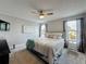 Comfortable bedroom featuring plush carpeting, a ceiling fan, and a serene gray color scheme at 2408 Saint Augustine Blvd, Haines City, FL 33844