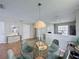 Charming dining area with a modern round table and stylish chandelier at 2408 Saint Augustine Blvd, Haines City, FL 33844
