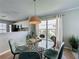 Cozy dining area featuring modern pendant lighting and views into the kitchen at 2408 Saint Augustine Blvd, Haines City, FL 33844