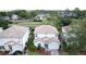 Charming two-story home featuring a well-maintained yard and a convenient two-car garage, and attractive tile roof at 2408 Saint Augustine Blvd, Haines City, FL 33844