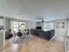 Open living space with dining area, living room, and view to the backyard at 2408 Saint Augustine Blvd, Haines City, FL 33844