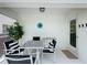 Cozy outdoor patio area with stylish furniture, perfect for enjoying outdoor meals and relaxation at 2408 Saint Augustine Blvd, Haines City, FL 33844