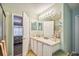 Bright bathroom featuring a vanity with ample storage and decorative accents at 247 Bell Tower Xing W, Poinciana, FL 34759