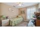 Cozy bedroom with daybed, neutral walls, and natural light from the window at 247 Bell Tower Xing W, Poinciana, FL 34759