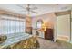 Comfortable bedroom with a floral comforter and a window view, creating a peaceful retreat at 247 Bell Tower Xing W, Poinciana, FL 34759