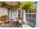 Cozy front porch with seating, decor, and potted plants at 247 Bell Tower Xing W, Poinciana, FL 34759