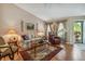 Comfortable living room with hardwood floors and ample natural light at 247 Bell Tower Xing W, Poinciana, FL 34759
