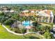 Beautiful pool area surrounded by palm trees and lush landscaping, offering a relaxing resort atmosphere at 247 Bell Tower Xing W, Poinciana, FL 34759