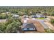 Aerial view of the home showing treed lot, surrounding homes and paved road at 2639 Sw 162Nd Street Rd, Ocala, FL 34473