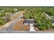 This aerial view captures a home nestled in a tranquil neighborhood with lush trees and well-maintained streets at 2639 Sw 162Nd Street Rd, Ocala, FL 34473