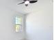 Minimalist bedroom featuring a window with natural light and neutral walls creating a serene and inviting space at 2639 Sw 162Nd Street Rd, Ocala, FL 34473