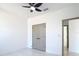 Neutral bedroom features closet with double doors, ceiling fan, and lots of natural light at 2639 Sw 162Nd Street Rd, Ocala, FL 34473