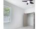 Bright bedroom featuring a window, a closet, and neutral walls, creating a simple and inviting space at 2639 Sw 162Nd Street Rd, Ocala, FL 34473