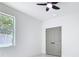 Well-lit bedroom showcasing a ceiling fan, double door closet and a window at 2639 Sw 162Nd Street Rd, Ocala, FL 34473