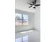 Bright bedroom with tile flooring, ceiling fan, and view through window at 2639 Sw 162Nd Street Rd, Ocala, FL 34473