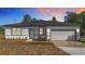 Charming one-story home featuring a fresh exterior, neat landscaping, and an attached two-car garage at 2639 Sw 162Nd Street Rd, Ocala, FL 34473