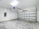 Spacious garage with automatic door, concrete floor and electrical panel at 2639 Sw 162Nd Street Rd, Ocala, FL 34473
