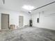 Spacious garage featuring gray painted doors, concrete floors and brick detail at 2639 Sw 162Nd Street Rd, Ocala, FL 34473