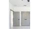 Hallway with gray doors offers access to various rooms and closet spaces at 2639 Sw 162Nd Street Rd, Ocala, FL 34473