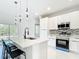 Modern kitchen features a kitchen island and stainless steel appliances at 2639 Sw 162Nd Street Rd, Ocala, FL 34473