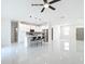 Open living space features tile flooring and a modern kitchen with island seating at 2639 Sw 162Nd Street Rd, Ocala, FL 34473