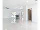 Bright, open-concept living room with sleek floors, modern lighting, and a view into the kitchen at 2639 Sw 162Nd Street Rd, Ocala, FL 34473