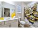 Themed bathroom with a sink and toilet decorated with cartoon characters at 2649 Calistoga Ave, Kissimmee, FL 34741