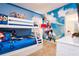 Vibrant ' room with bunk beds, bright blue accents, and cartoon decorations at 2649 Calistoga Ave, Kissimmee, FL 34741