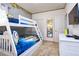 Cheerful bedroom featuring a white bunk bed and playful character accents at 2649 Calistoga Ave, Kissimmee, FL 34741